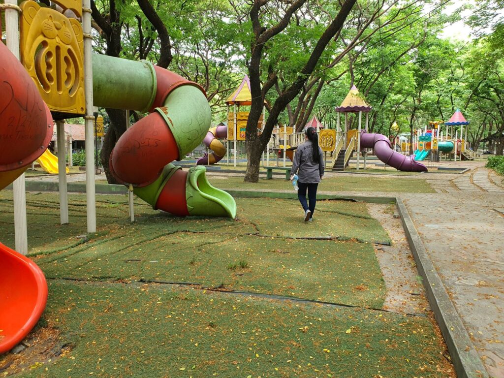 girl strolling in a community park playground