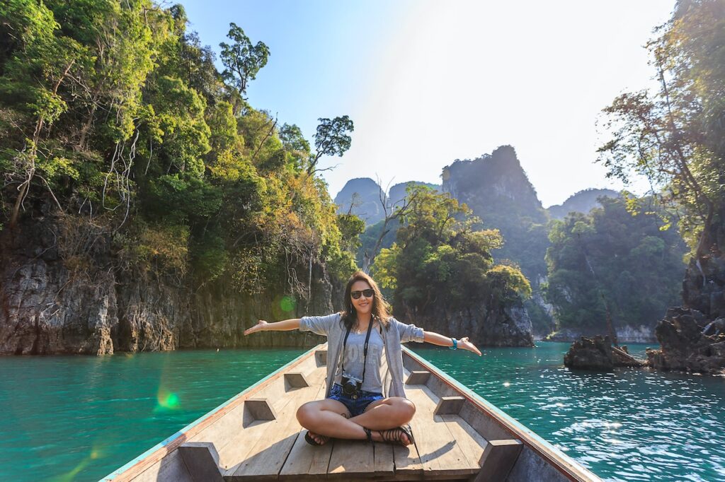 Foreigner tourist on a boat ride exploring islands in the Philippines