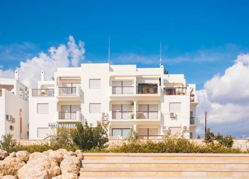 A stylish hotel apartment and residence in a seaside community, highlighting modern amenities and aspirational living.