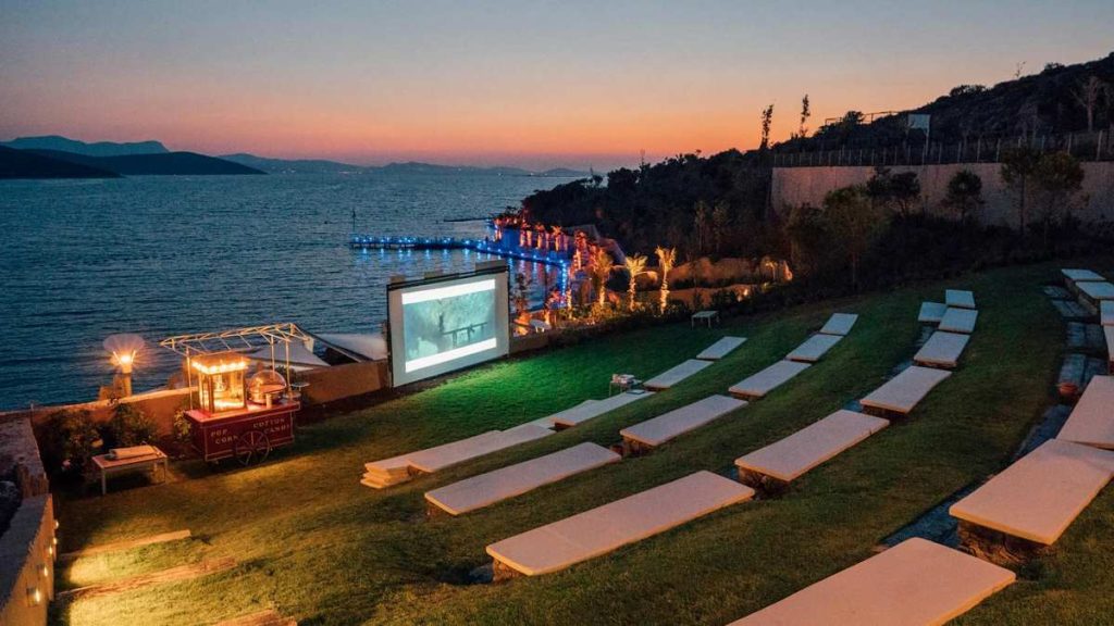 An open theater by the sea for local arts performance with the ocean in the background.