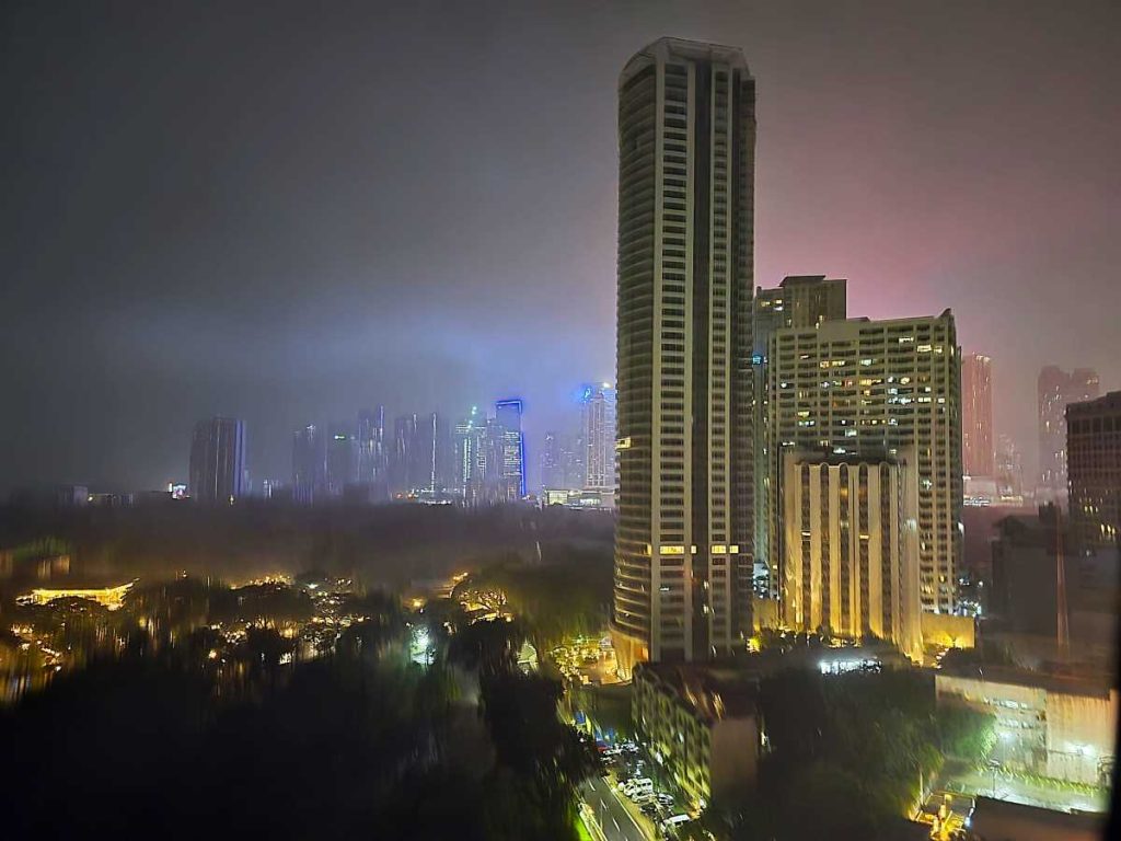 Metro Manila skyline at night highlighting prime real estate in the Philippines.