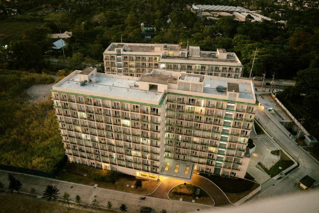 Aerial view of a planned housing development, highlighting sustainable growth driven by investment incentives.